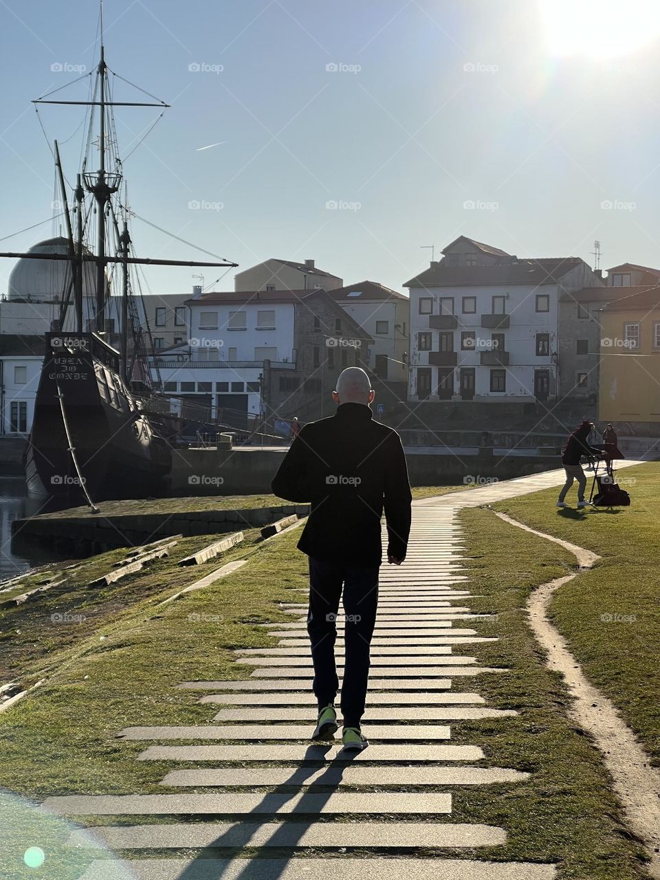 Man walking towards boat