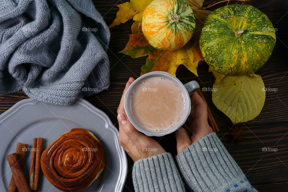 warming up mug of hot chocolate