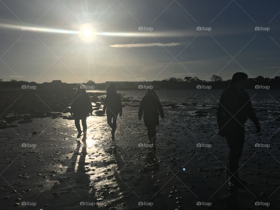 Taken in a freezing day in a beach in Ireland where I went cockle and mussel hunting. The sun has created a silhouette 