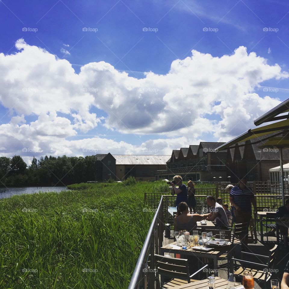 Four Pillars Hotel on the lake from The Old Boathouse pub, Cotswolds, UK