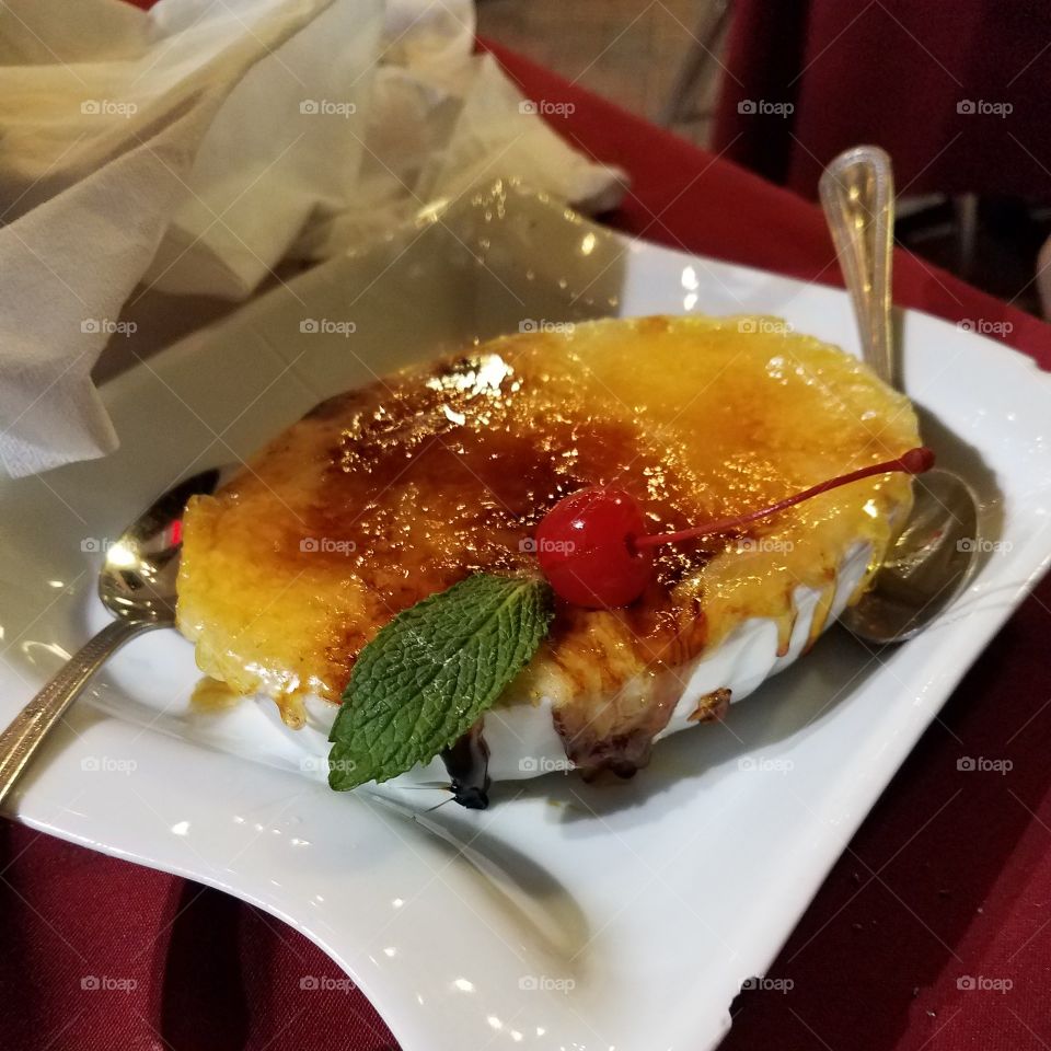 creme brulee with a cherry on top