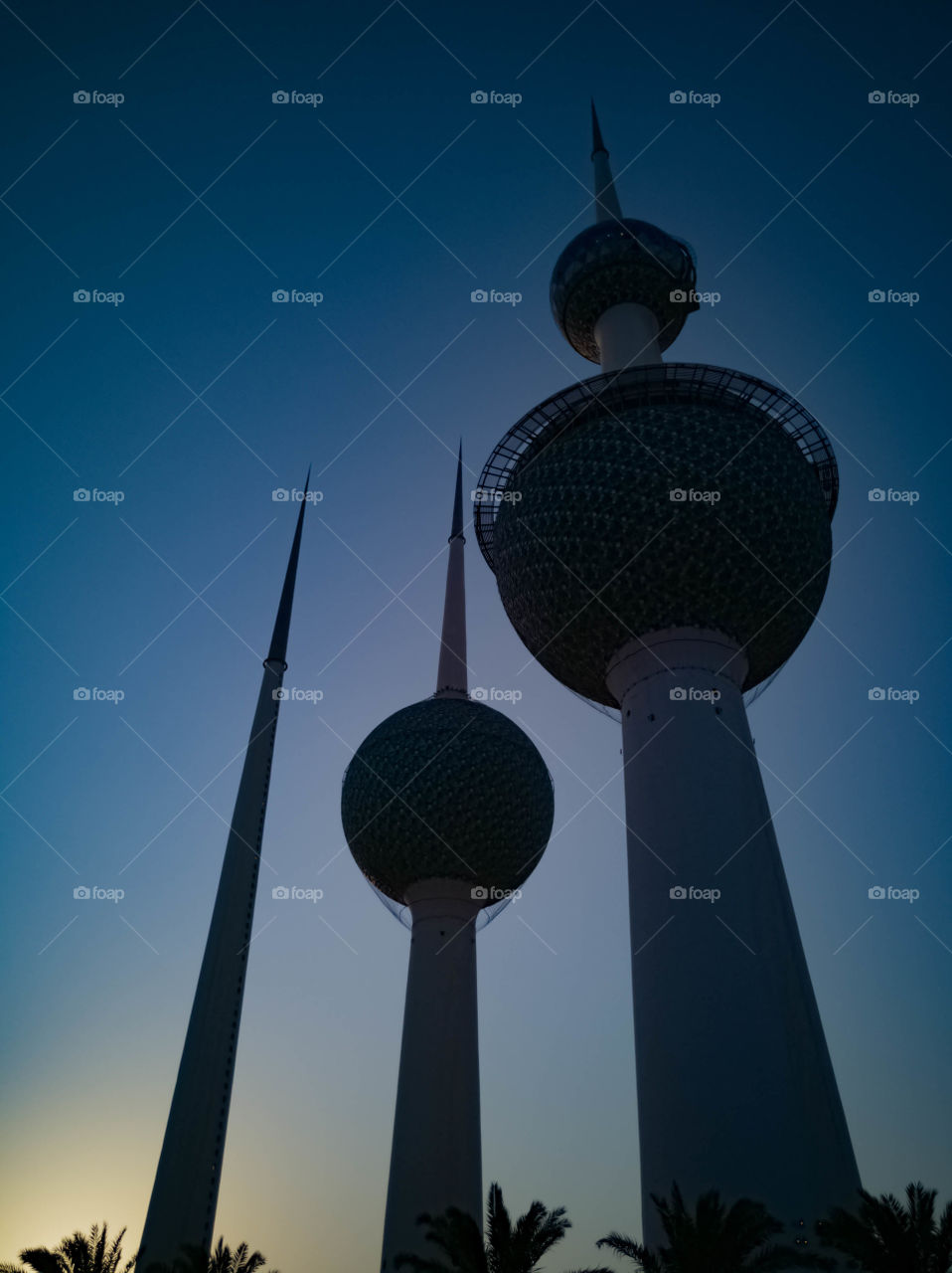 Silhouette of the Kuwait Towers with a beautiful Turquoise sunset sky background
