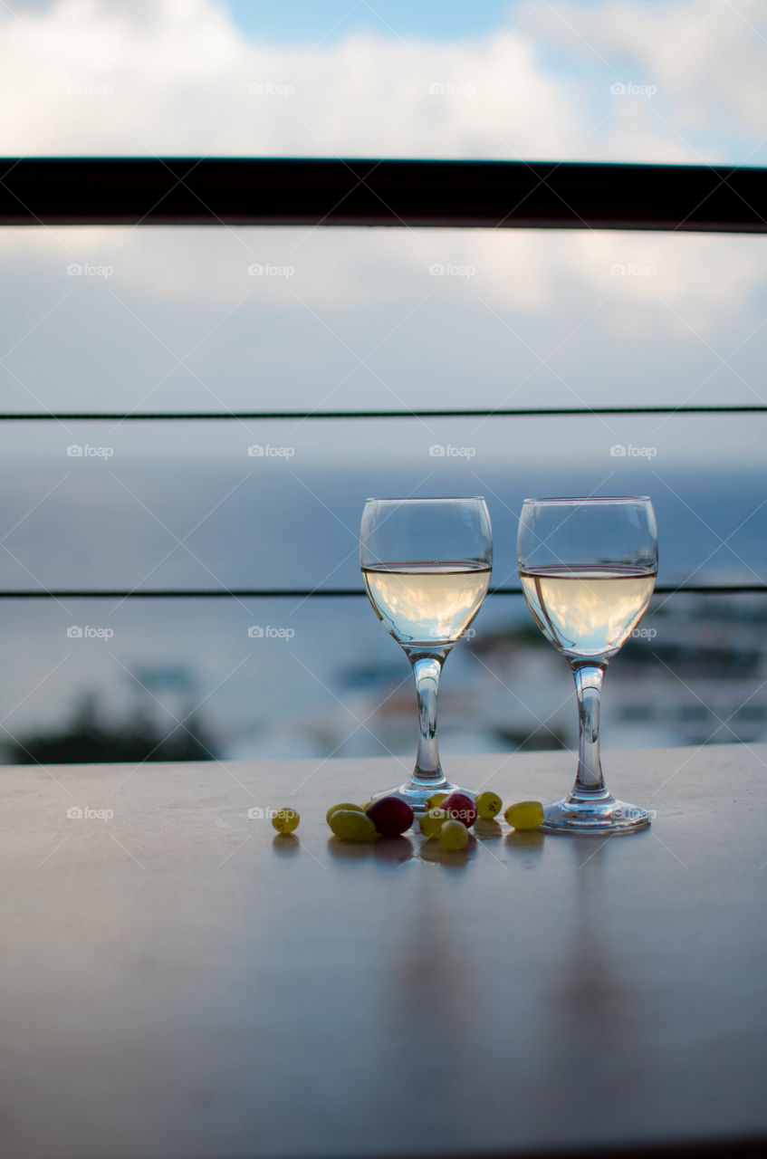 Wineglasses in front of beach