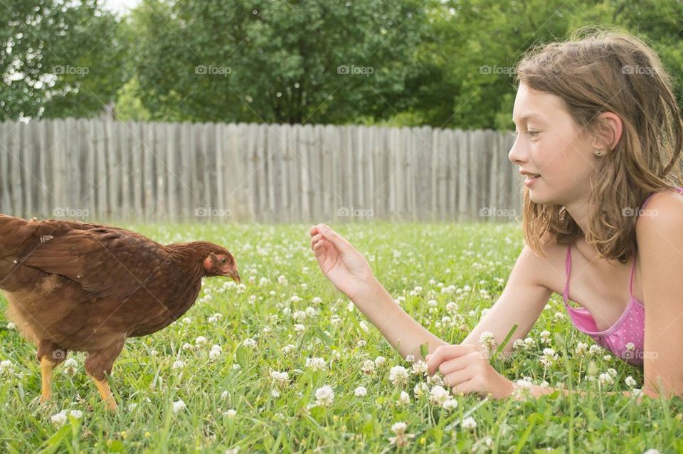Girl and chicken
