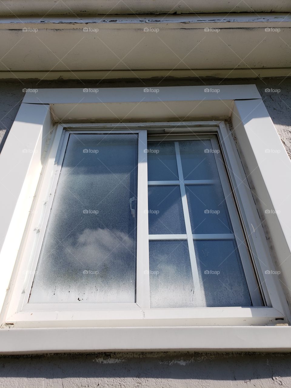 old dirty painted window outside of house