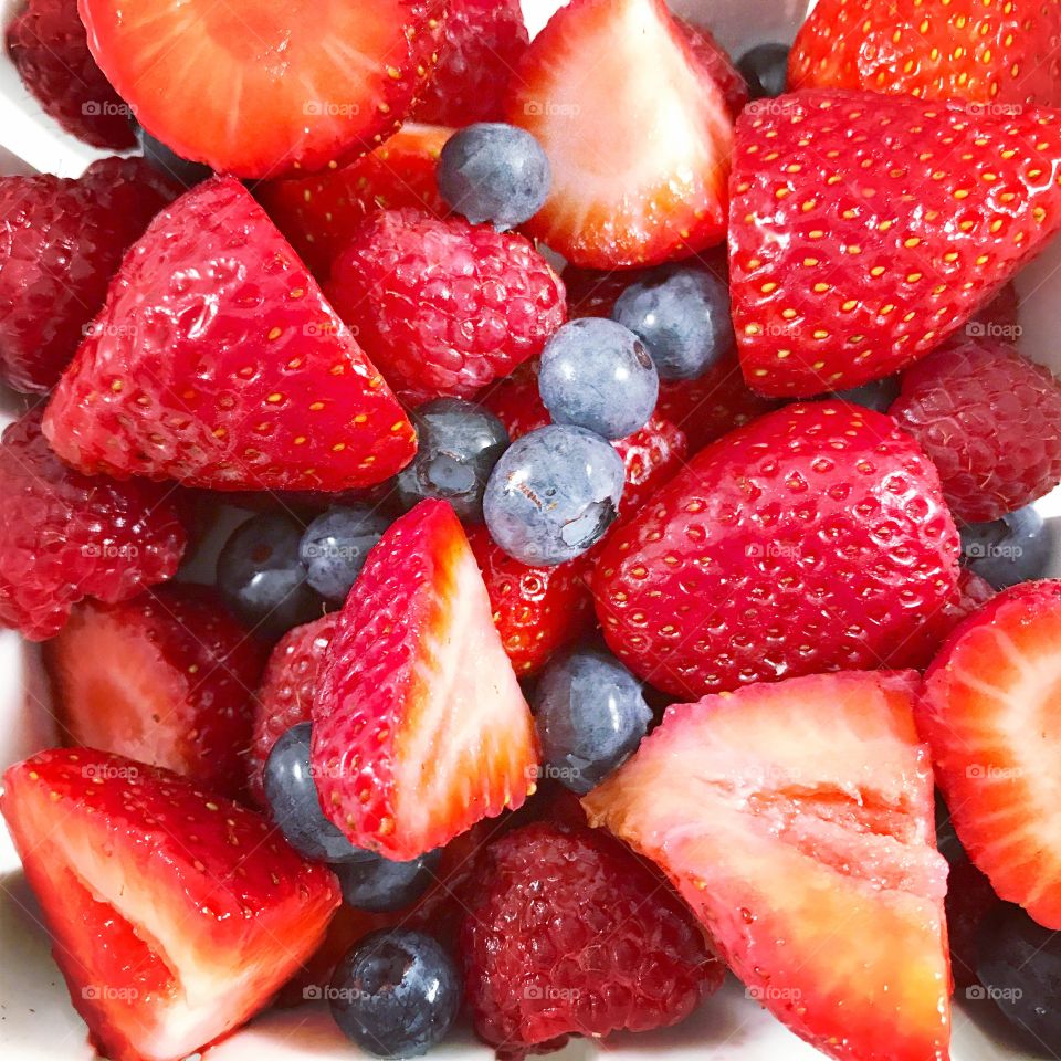 Blueberries and slice of strawberries