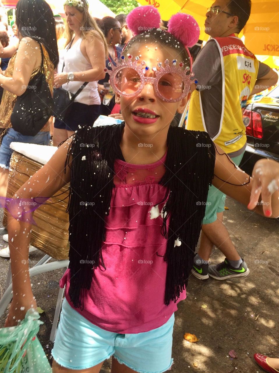 Child in costume playing street carnival