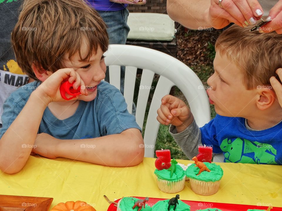 Childhood Birthday Party. Young Cousins Born On The Same Day Sharing A Birthday Party