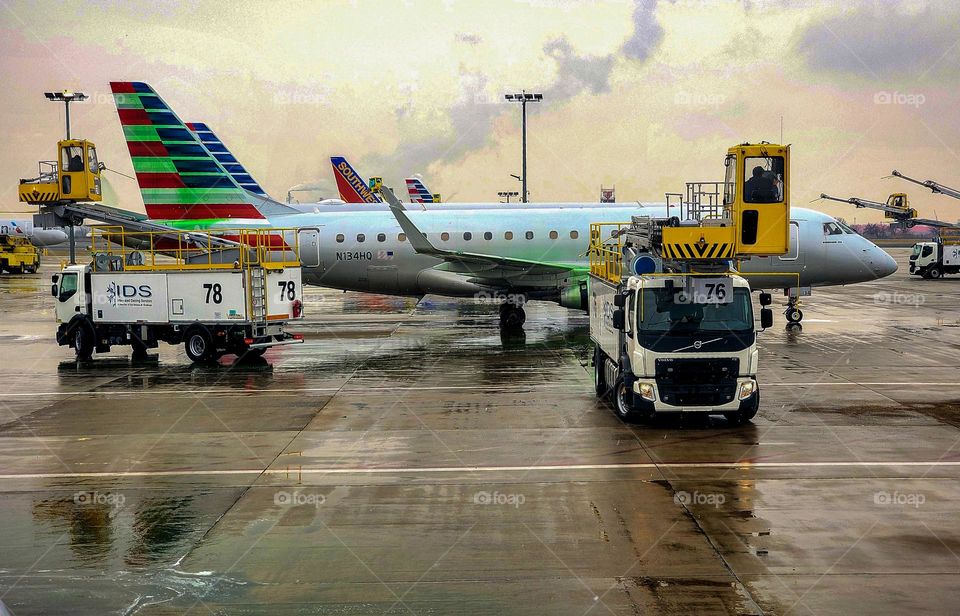 An airplane deices prior to taking off at Philadelphia International Airport
