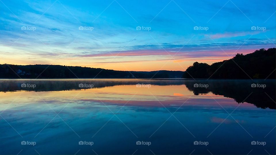 Scenic view of lake during sunset