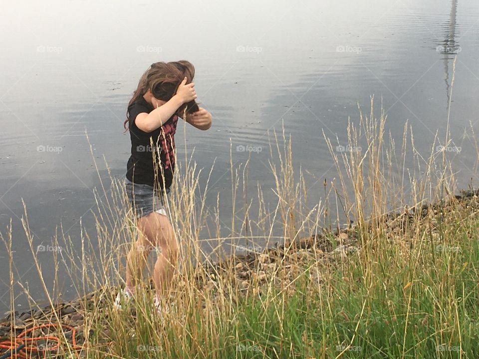 Girl outside next the water 