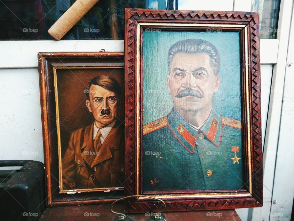 Old portraits of Stalin and Hitler