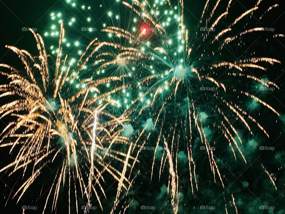 Fireworks display in green and white