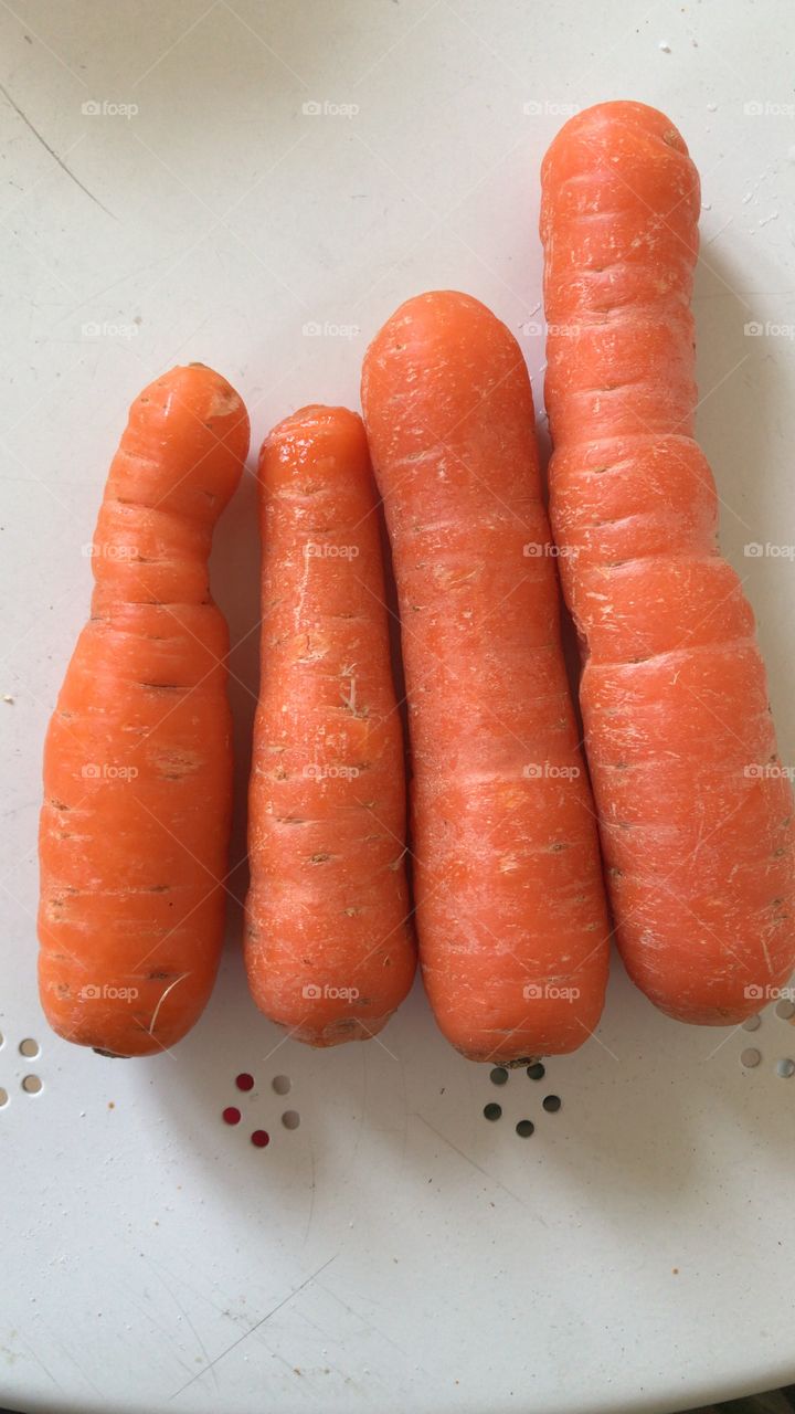 Four orange carrots