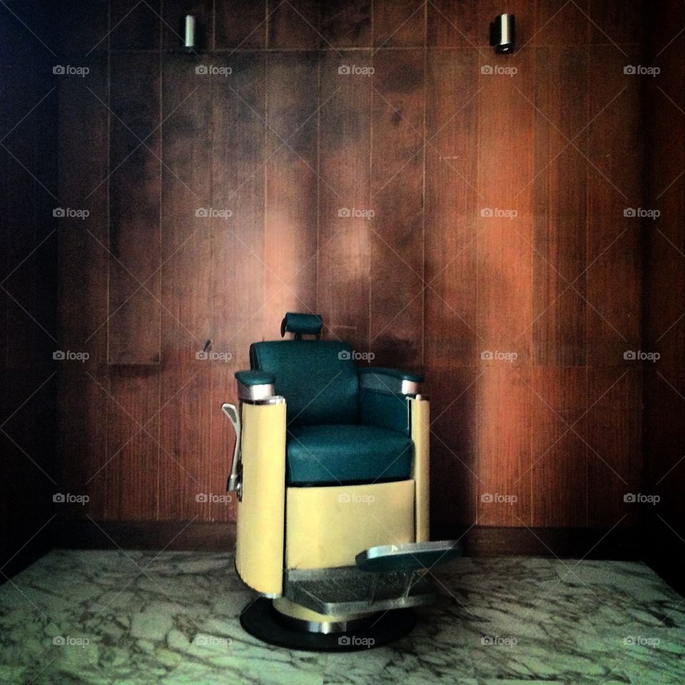 Babes chair. An empty old barber chair