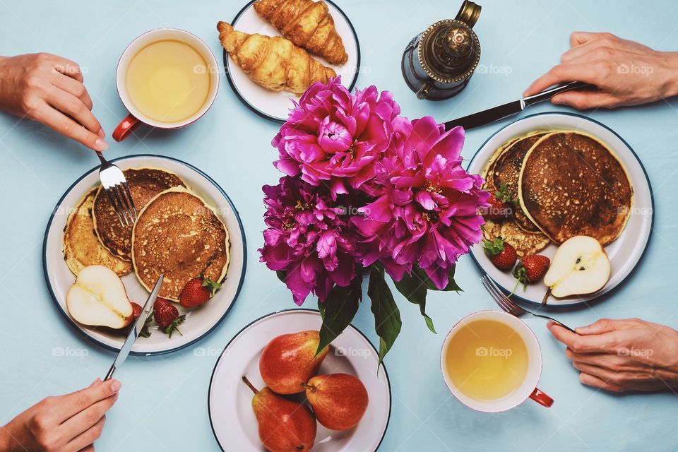 Two people having breakfast, top view