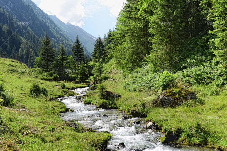 European alps landscape. Stream flowing though Schwarzachtal valley in zillertal alps. Austria.