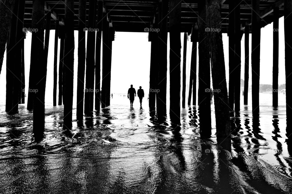 Silhouettes Under the Pier