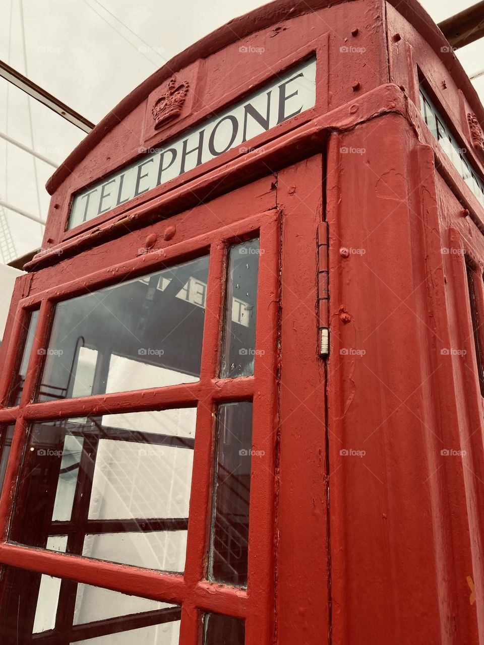 Vintage red English phone booth .