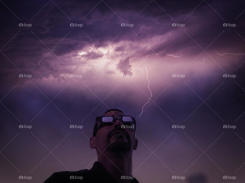 Concept: Mustachd man with a stormy background.