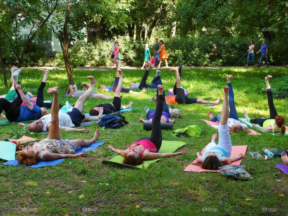 group of people doing yoga outdoors, Ukraine, Kiev