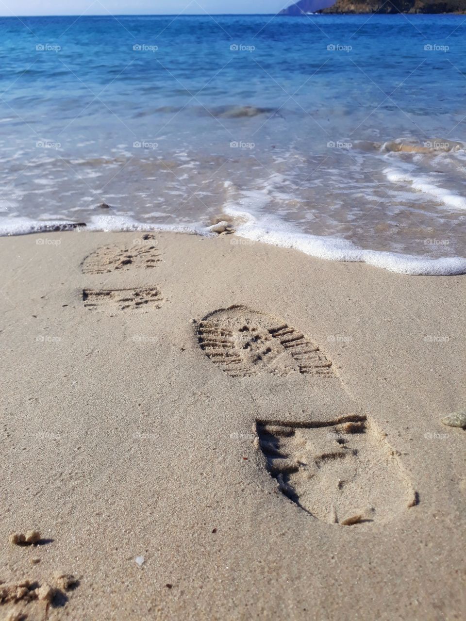 footprint of military boot in the seashore