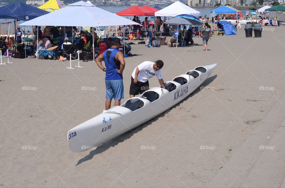 A kayaking competition takes place on Alki beach in West Seattle, Washington.