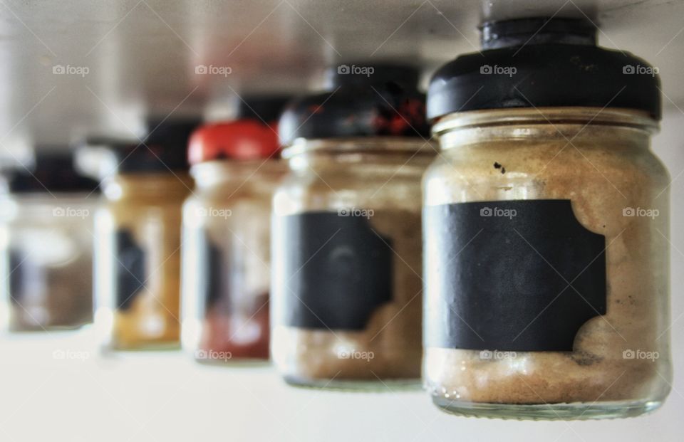 Line of spices jars. Cooking tools for the kitchen