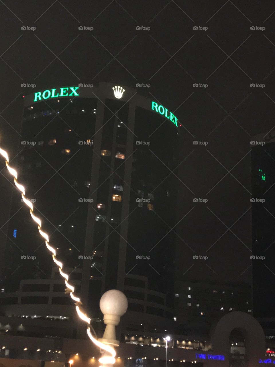 A night view of the Rolex Tower Dubai £20.00. 