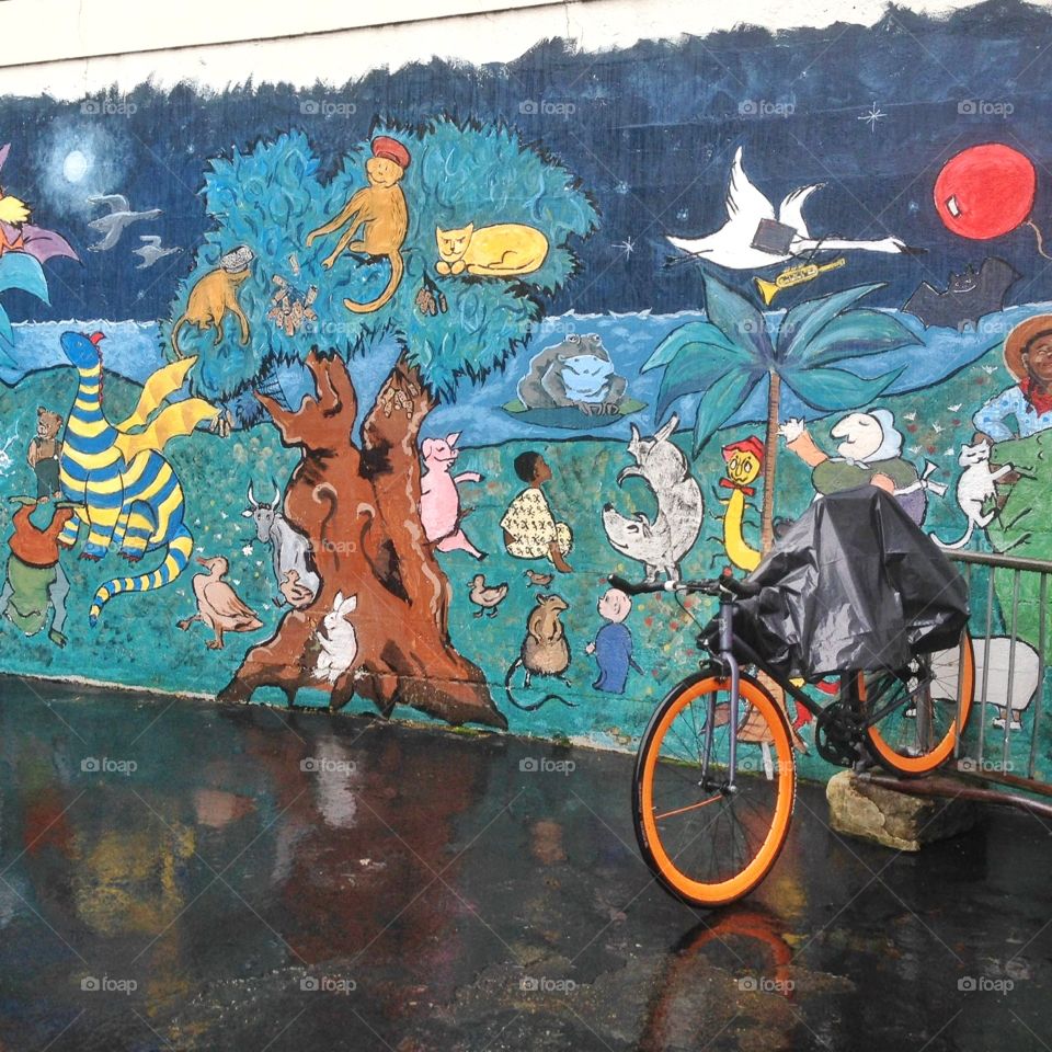 City bicycle in front of mural