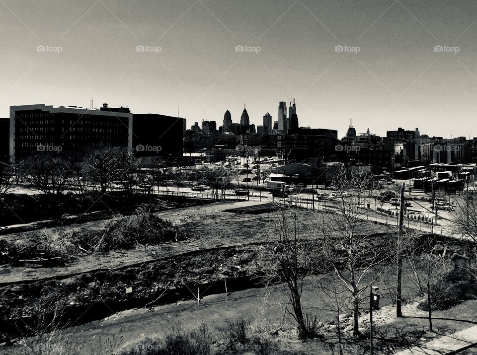 Black and white photo of the Philadelphia center city skyline as seen from penn ave on the waterfront. 