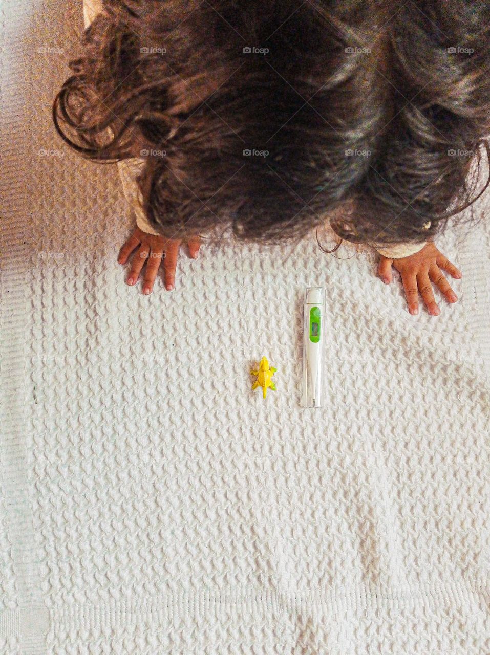 young girl watching thermometer