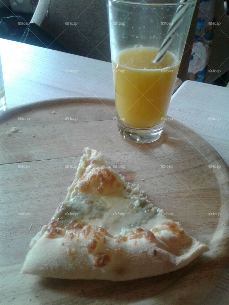 Glass of juice and puzza