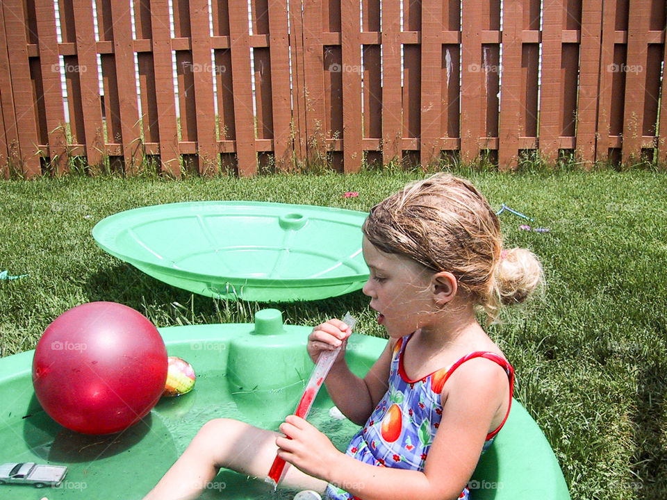 Hot summer day in the back yard- ice pops and kiddie pool is how I spent a lot of my summer.