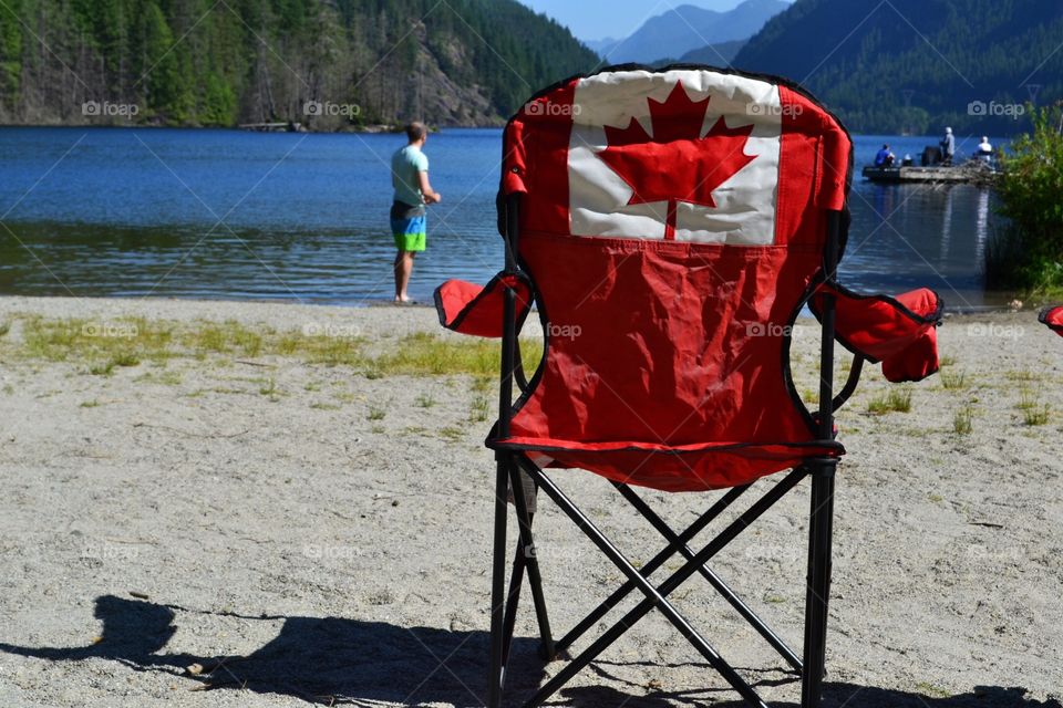 Beautiful Canada. Canadian flag chair at lake