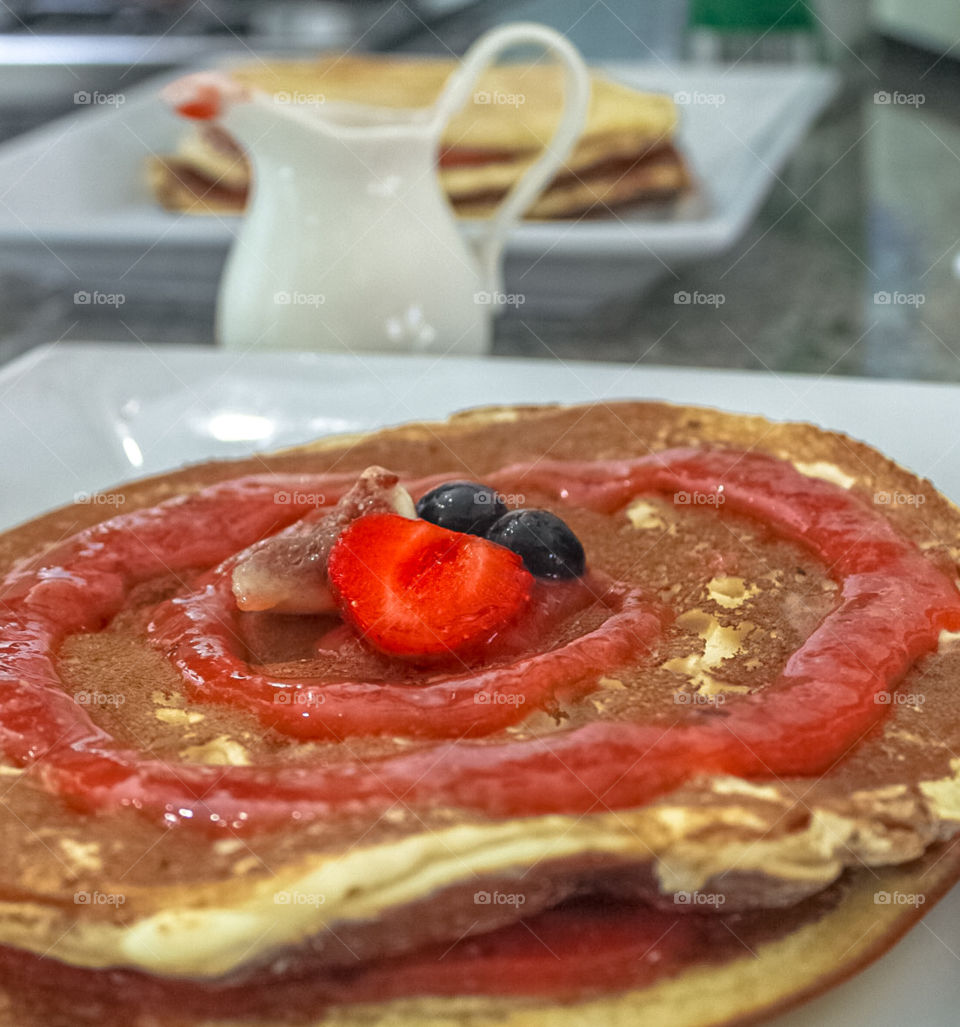 Pancakes with a blended fruity sauce