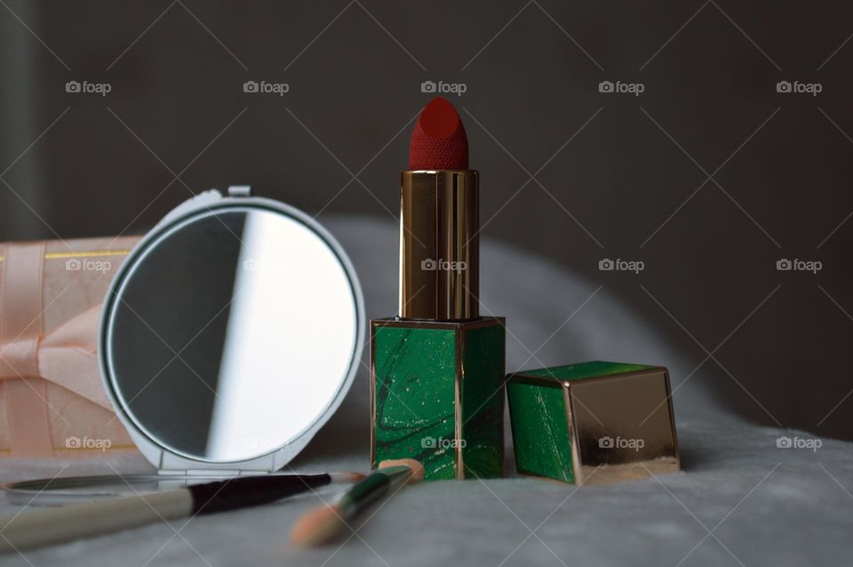 Decorative cosmetics for the face, for bright makeup, red classic lipstick and mirror, makeup sticks, girls' and women's makeup