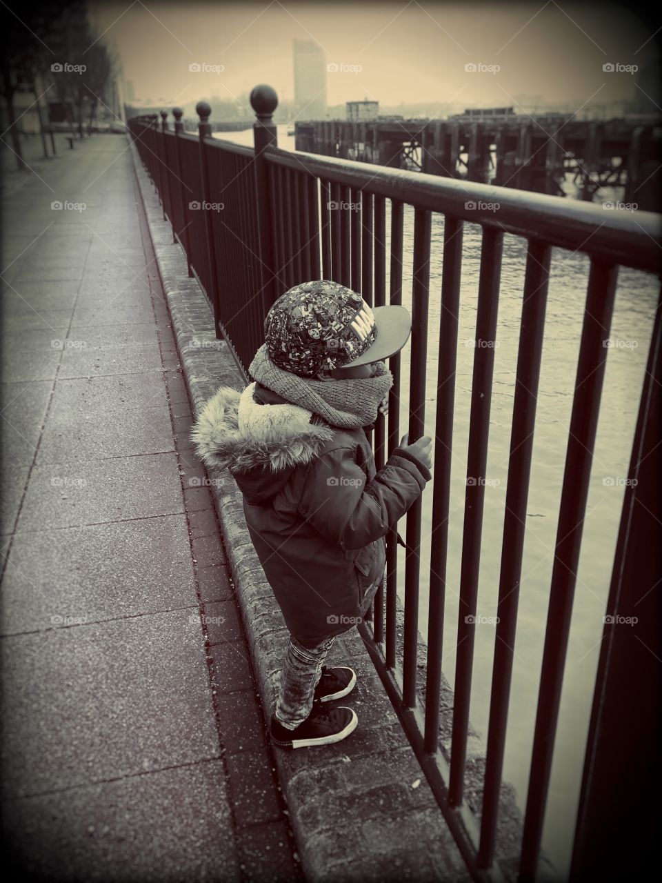 My son loves to watch the boat go by on the River Thames 