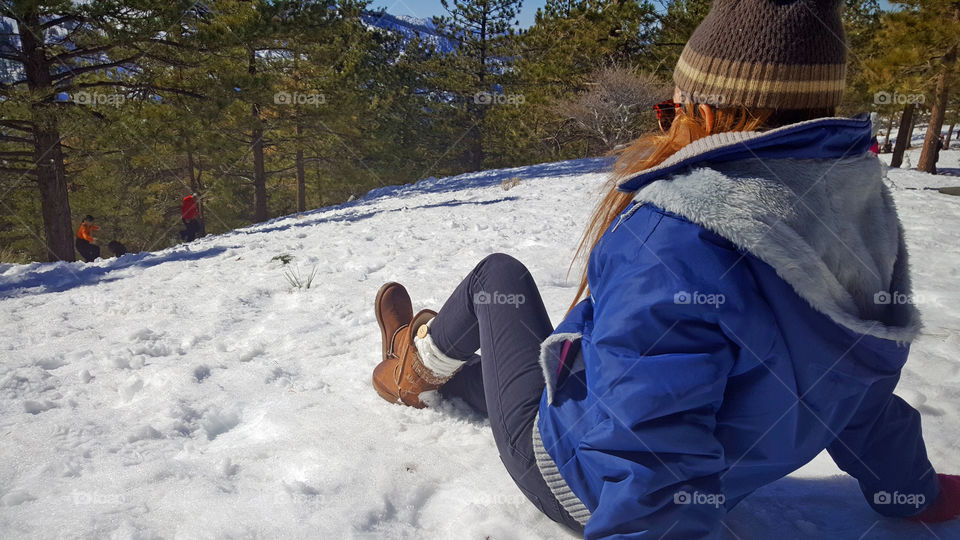 girl relaxing on the mountain, snow view