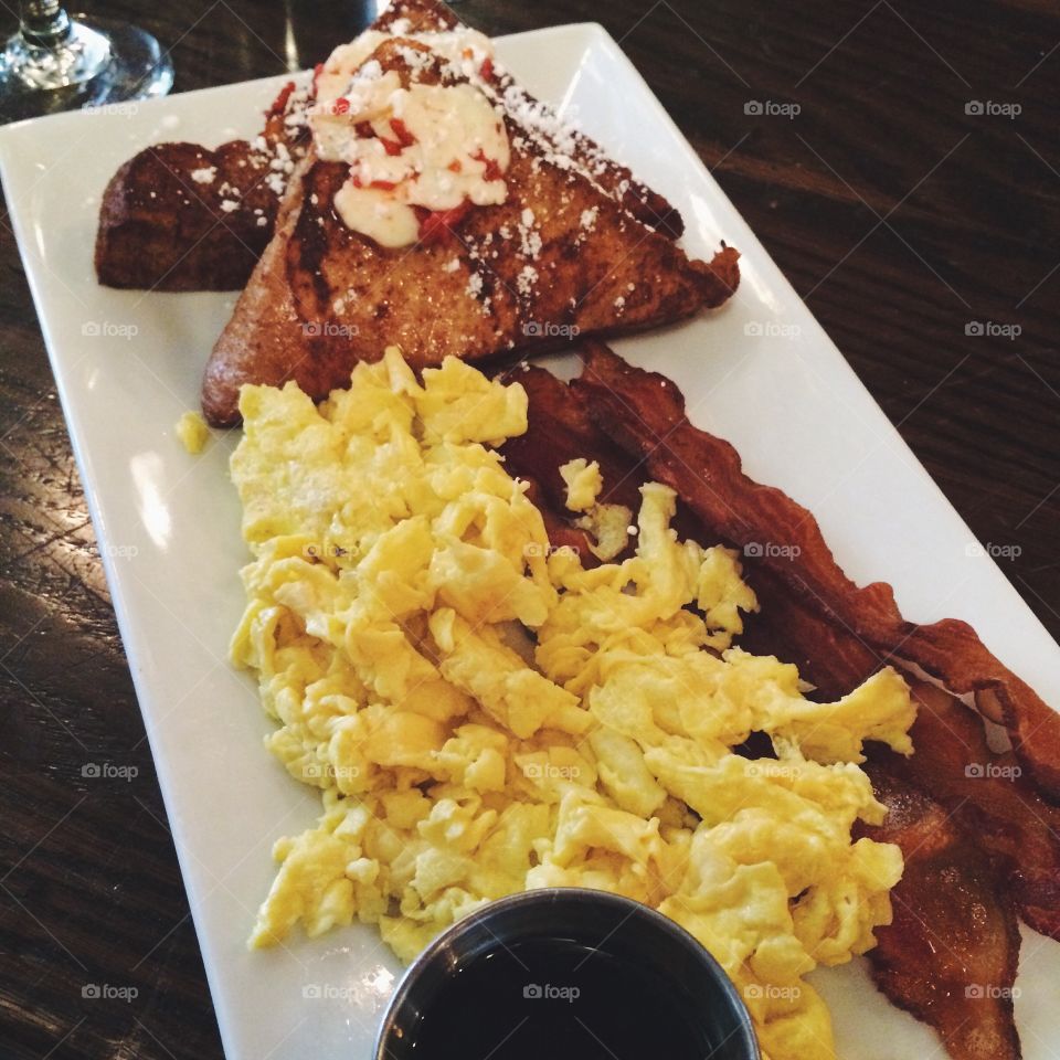 Eggs, bacon & French toast. Brunch at a local Upper East Side NYC restaurant 
