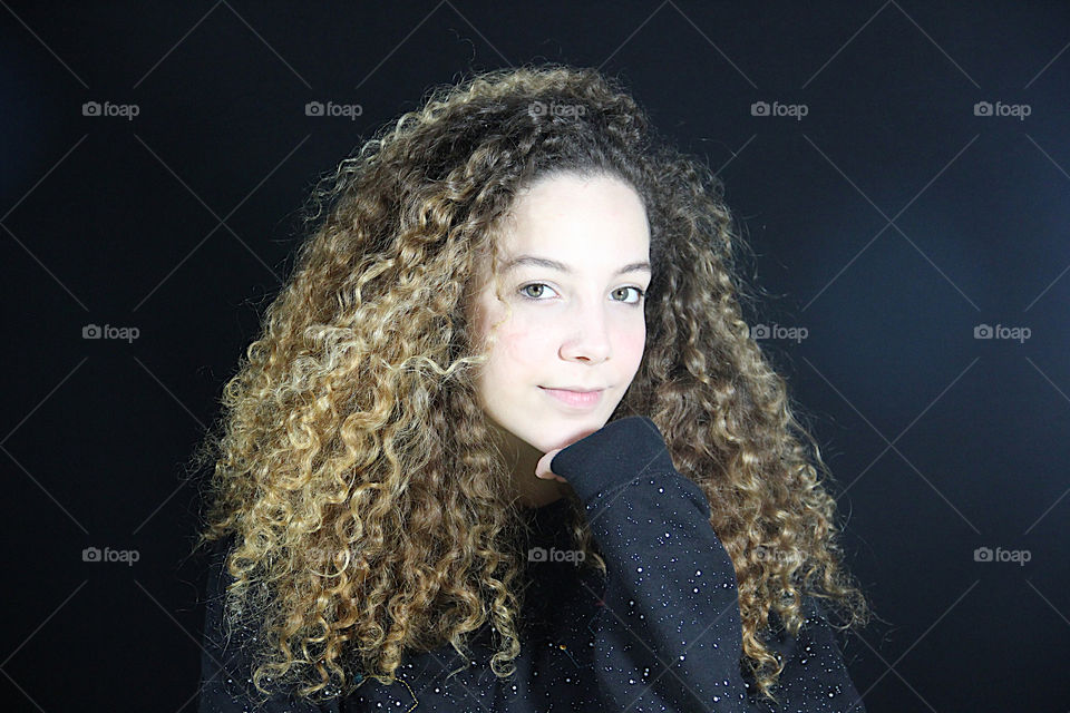 Portrait of blonde girl with curly hair