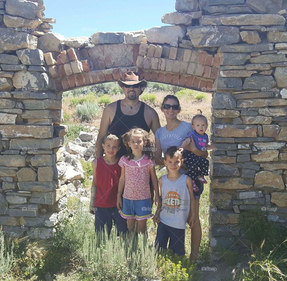 our family in the ruins of an old mining ghost town called Hamilton in rural Nevada in the United States of America 2017 with mountains all around mines