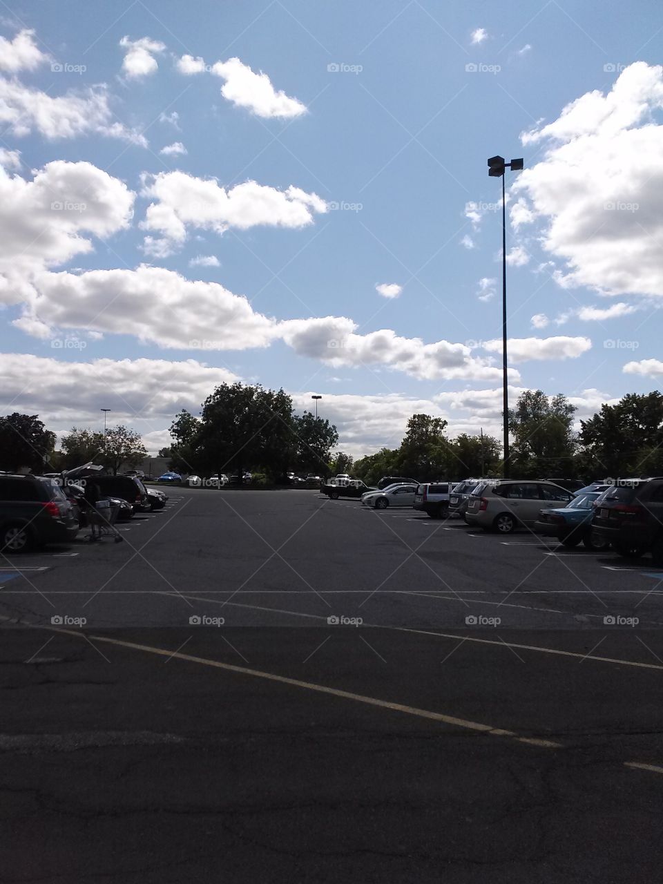 Fluffy Clouds over The Parking Lot