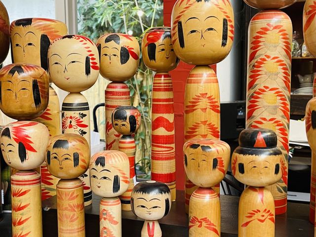 Assorted wood kokeshi dolls, engraved typical Japanese dolls, Japanese crafts, Japanese art and tradition 
