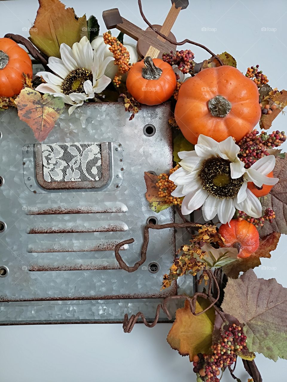 Fall decorations in a rusty mailbox