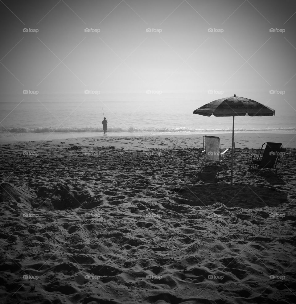 Foggy morning fishing at the ocean