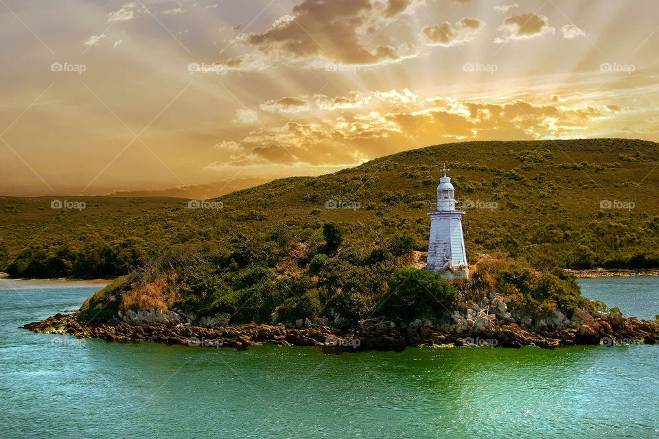 Lighthouse At Sunset