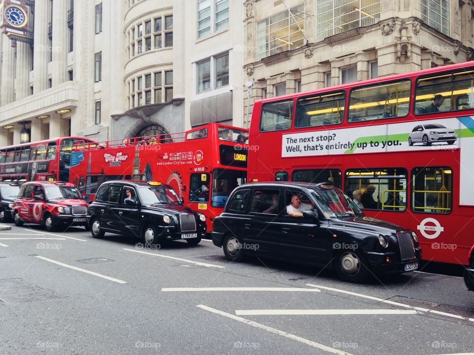 Double Decker red tour buses and black taxis
Fleet Street London 