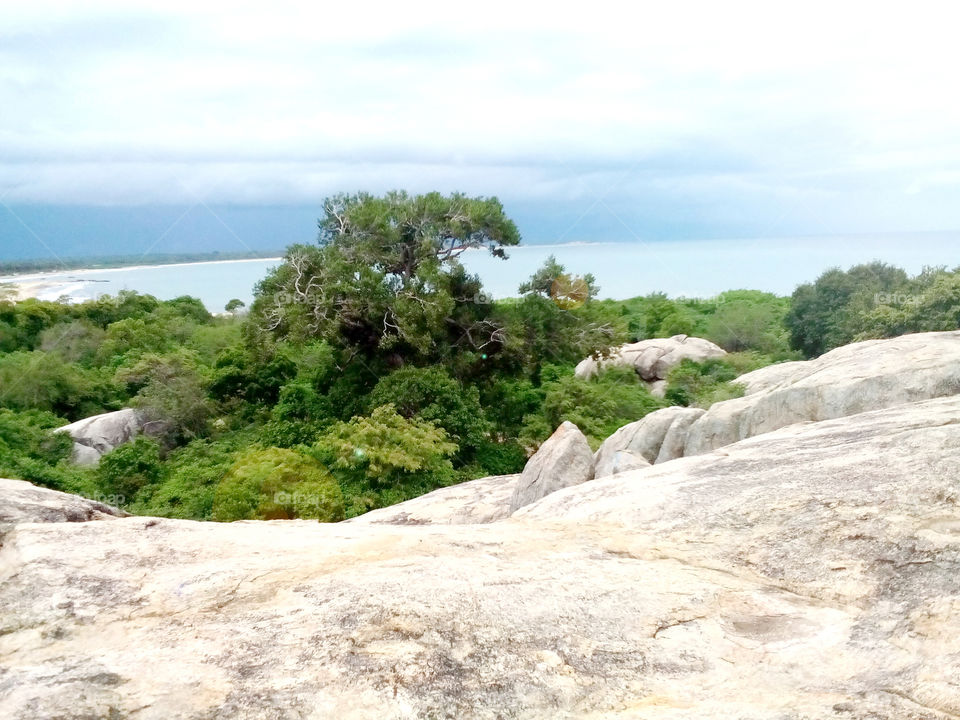 Blue sky, and Blue sea view from above rock montain.