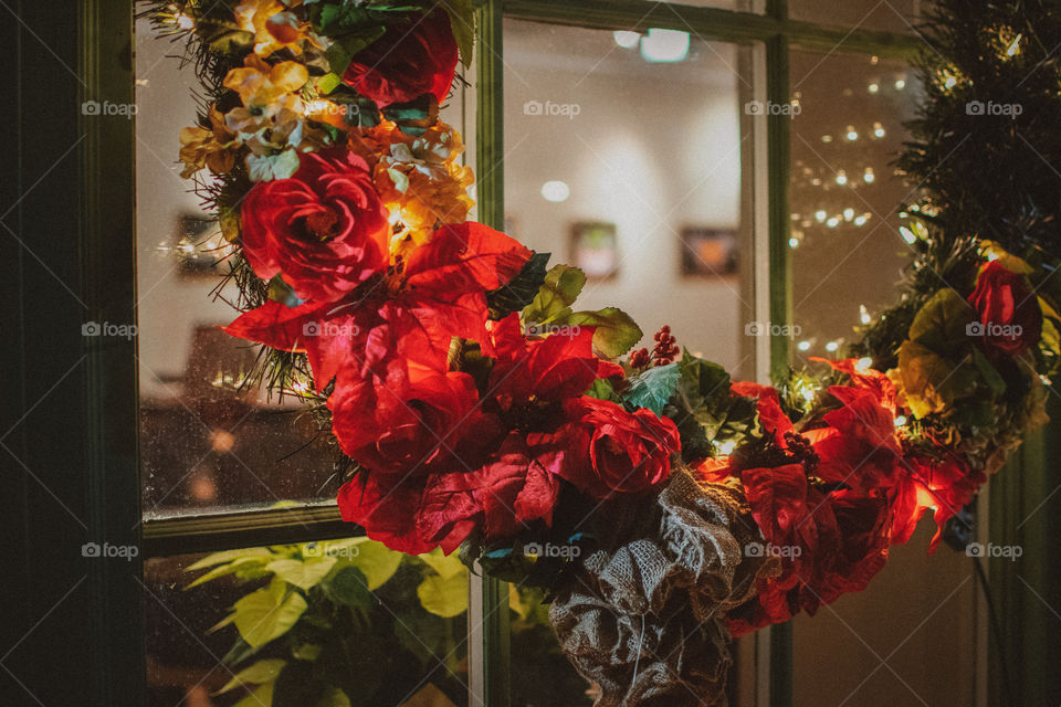 Christmas wreath hanging by the window